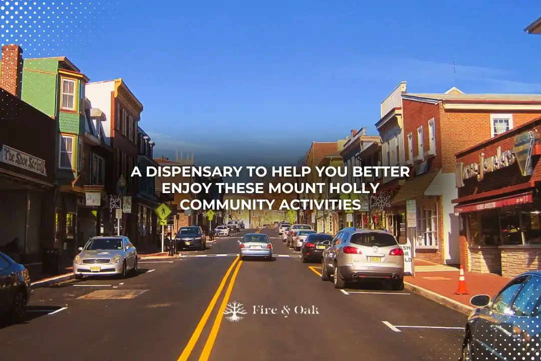 Street view of Mount Holly featuring local shops and businesses, promoting Fire & Oak dispensary as a resource for enhancing community activities.